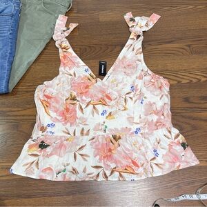 Express floral sleeveless top with tie straps, V-neckline, and a ruffled hem XL